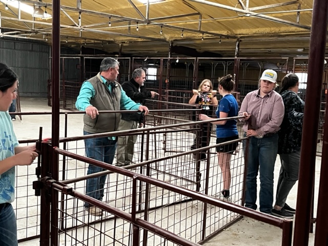 FFA students and teachers set up for the county stock show.