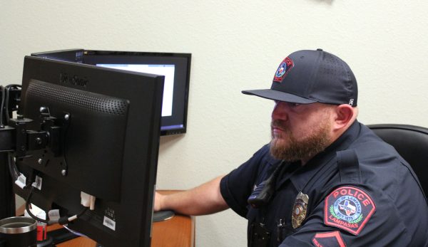 School Resource Officer Dustin Roscoe works in office March 26.