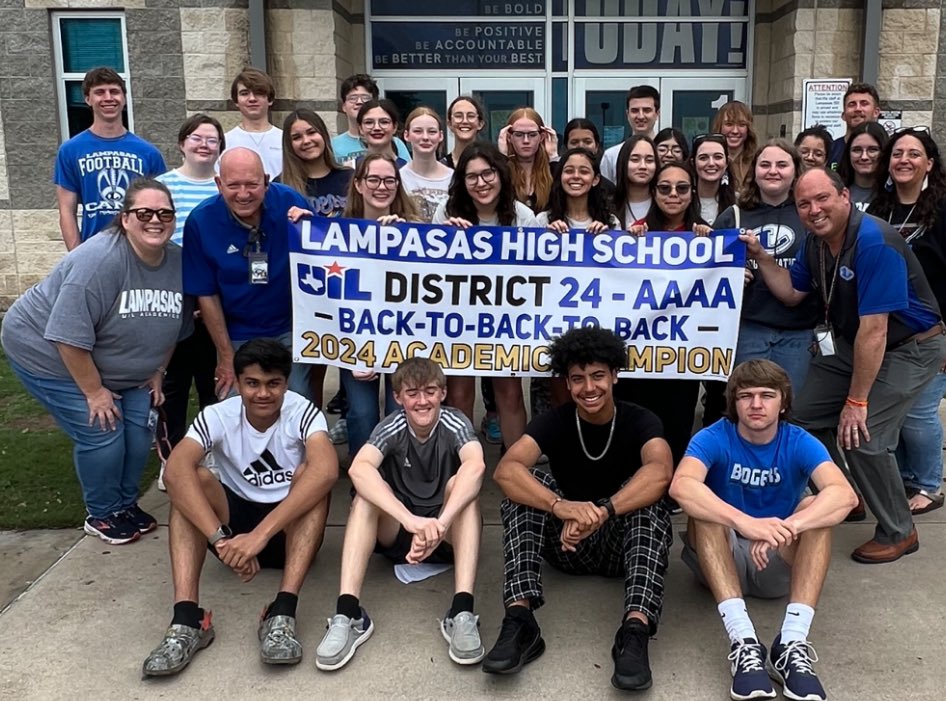 Regional qualifiers pose with their back-to-back-to-back district champions banner before traveling to Nacogdoches for regionals April 26.