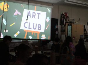 Students attend an Art Club interest meeting during academic period in art teacher Judith Brown's classroom.