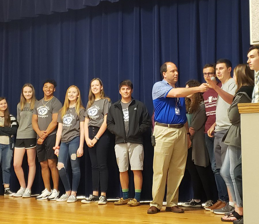 A new assistant principal at the time, Paul Weinheimer speaks to UIL students on stage before they leave for the regional competiton in spring 2019. 