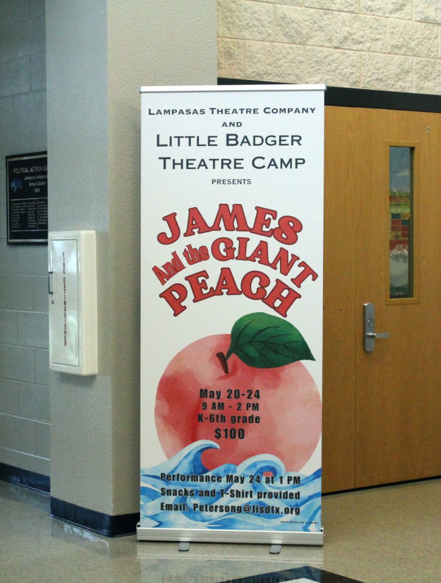 Poster advertises theatre camp in foyer. 