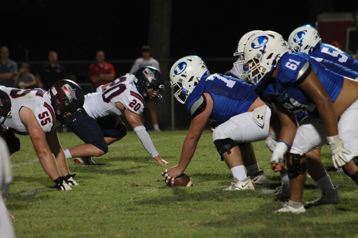 Badgers prepare for a play against Wimberley.