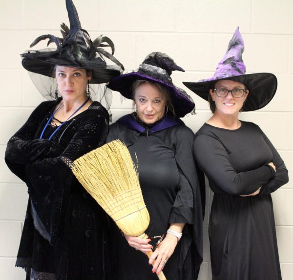 English III teachers Jenn Moore, Dondi Hinds and Desiree Kachel dressed as witches Oct. 31.