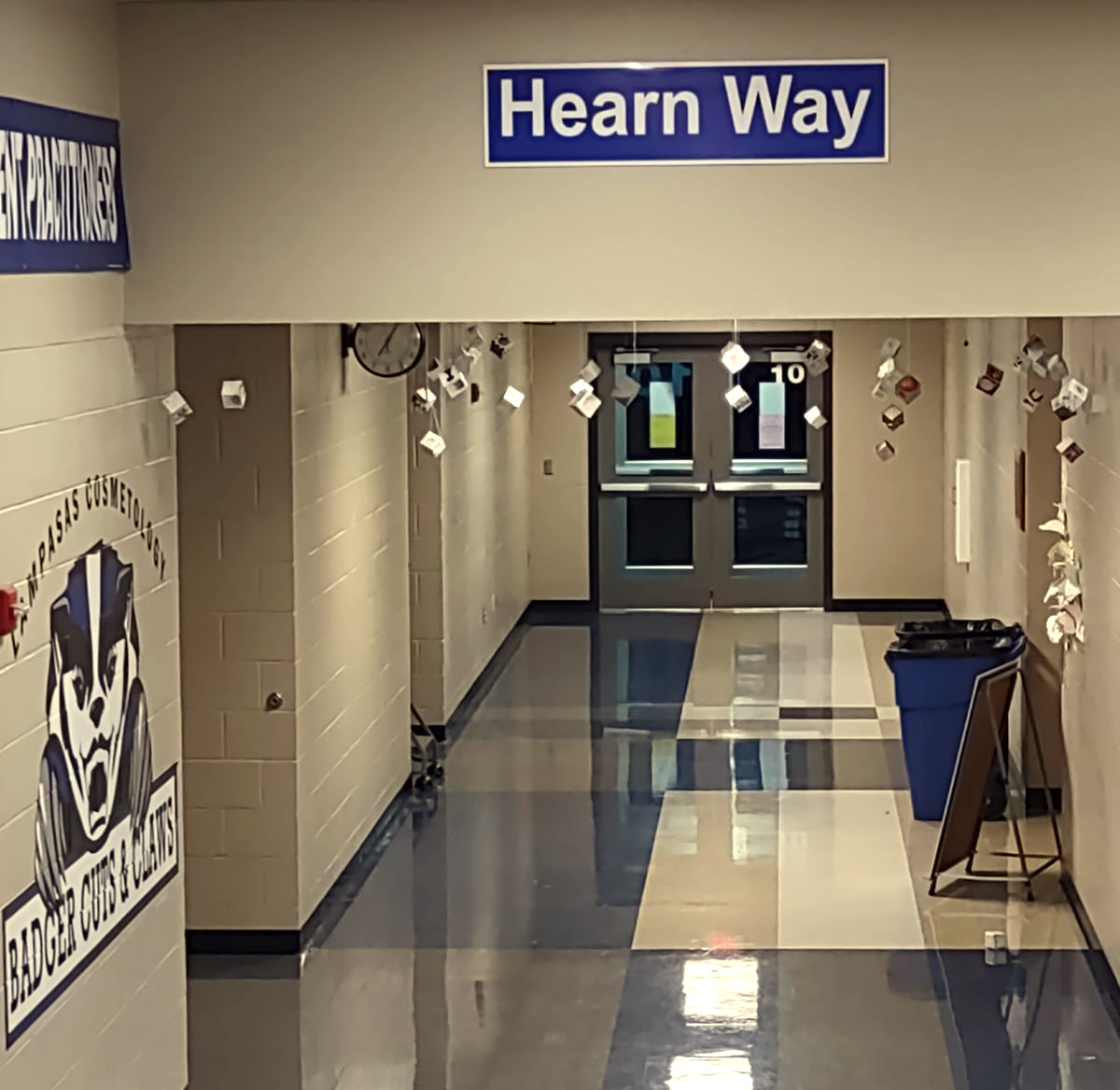 The Hearn Way sign hangs in the hallway outside the cosmetology classroom. Principal Paul Weinheimer said it should hang "in the hall where she inspired so many."