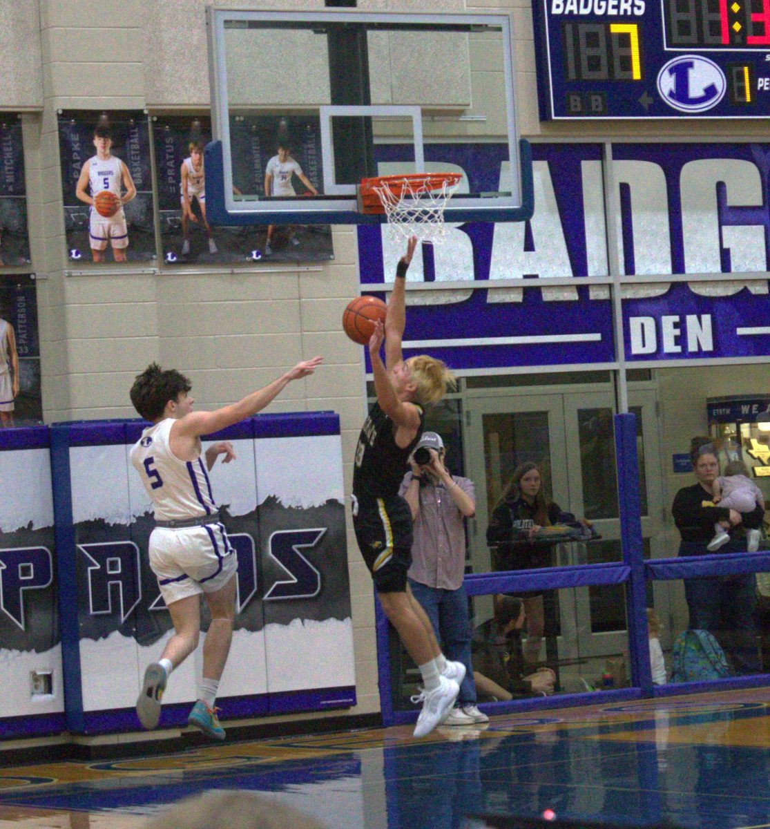 Senior Micah Papke recovers the ball during game Dec. 3.