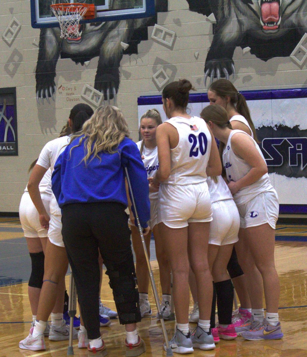 The girl's basketball team huddles during Dec. 3 game. 