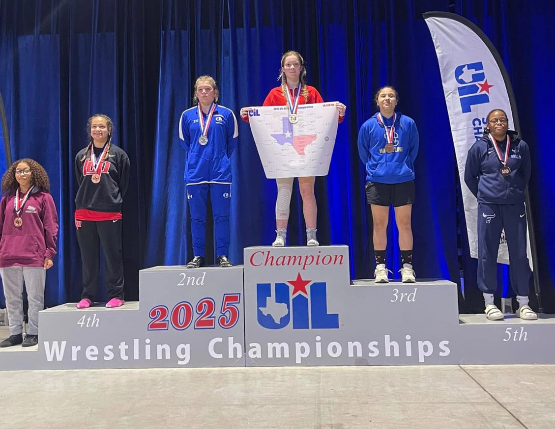 Junior Taylor Martell stands on podium after winning 2nd place at state tournament. 
Photo courtesy of Elma Garnett