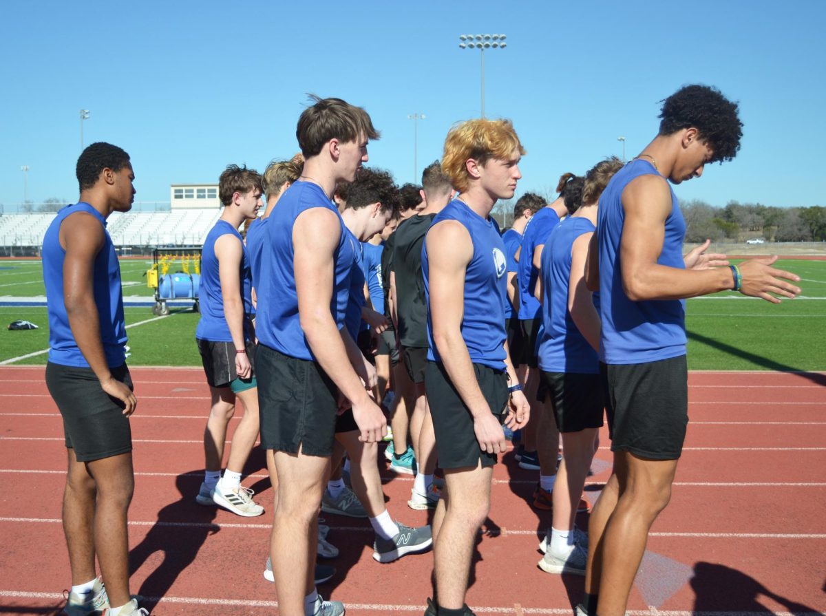 Track athletes warm up during practice Feb. 25.