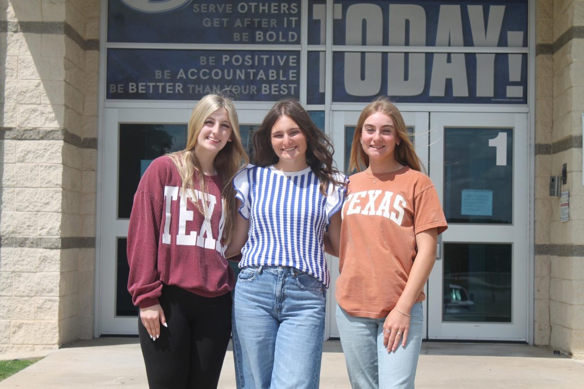Seniors Meredith McBeth, Paige Rutland, and Loretta Hodges pose outside of LHS.