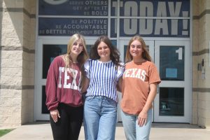 Seniors Meredith McBeth, Paige Rutland, and Loretta Hodges pose outside of LHS.