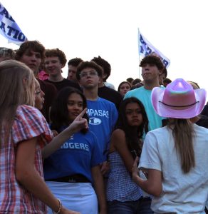 Students discuss problems in the student section Sept. 12
