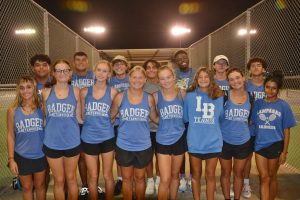 The varsity tennis team celebrates their district championship in Gatesville Sept. 30.