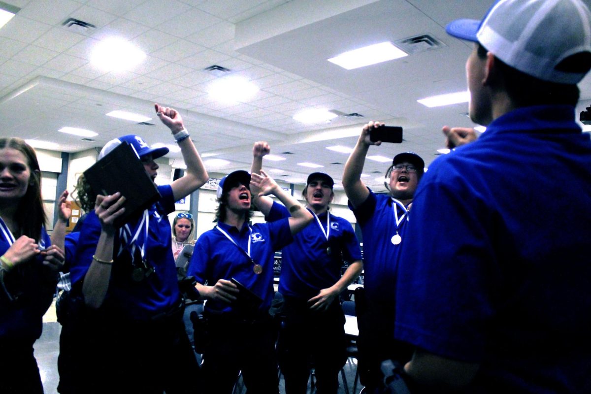 The Law Enforcement team celebrates their Regional wins at the Law competition Dec. 6.