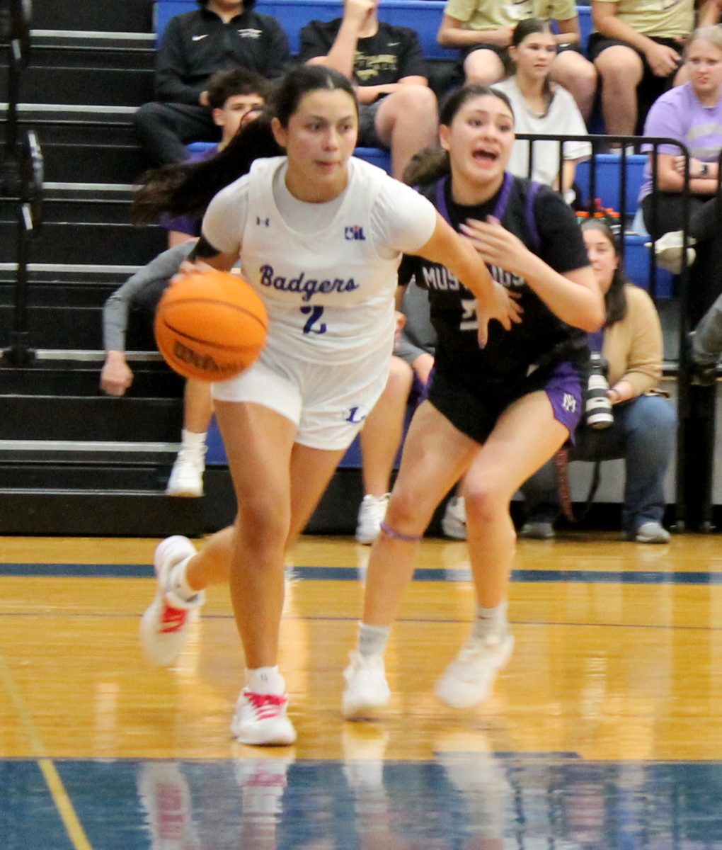 Senior varsity basketball player Johnnie Lewis competes against Marble Falls in the Lampasas competition gym Jan. 13.