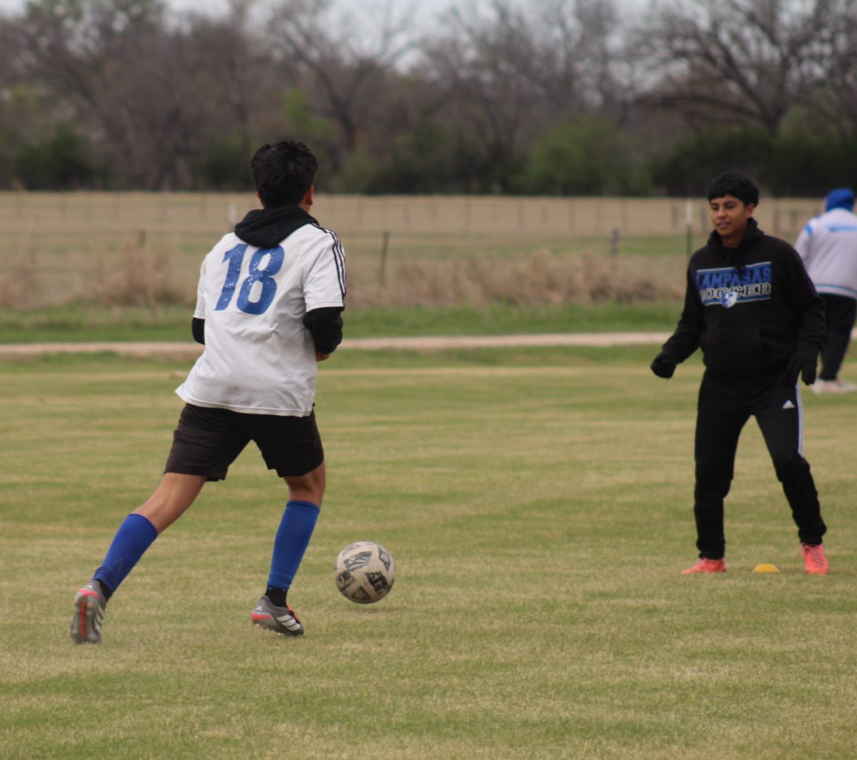 Junior Alan Fuentes and senior Chris Mendoza at after school practice March 16.