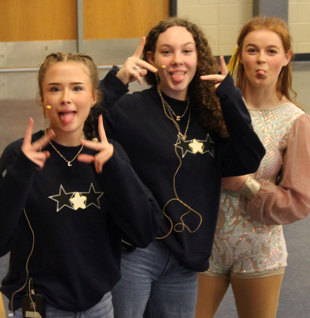 Sophomores Lillian Hays, Emma Franklin, and McKenna Harpster prepare before talent show. 