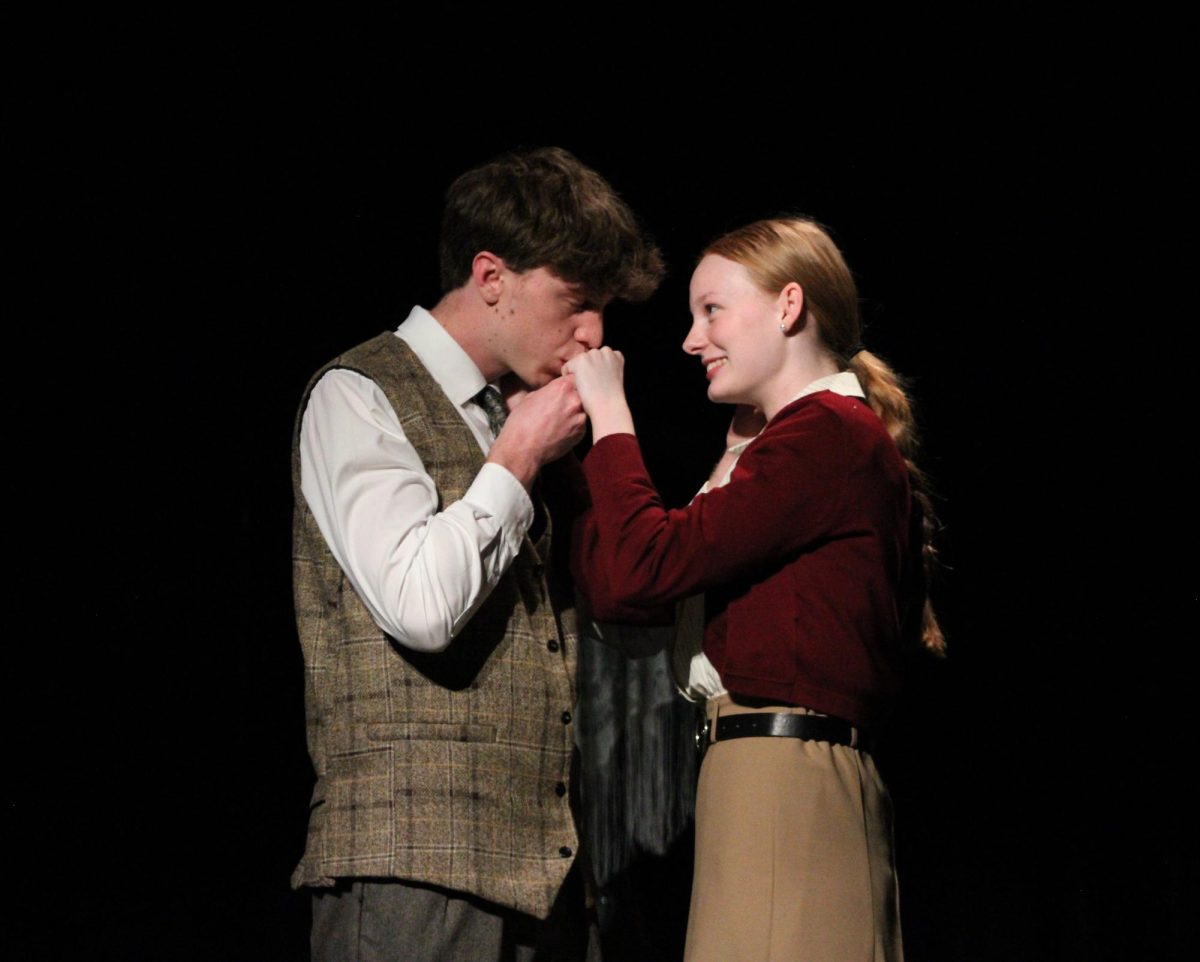 Senior Cale Wheeler and junior Kenzie Stone rehearse scene after school March 27. Courtesy of Ella Davidson. 
