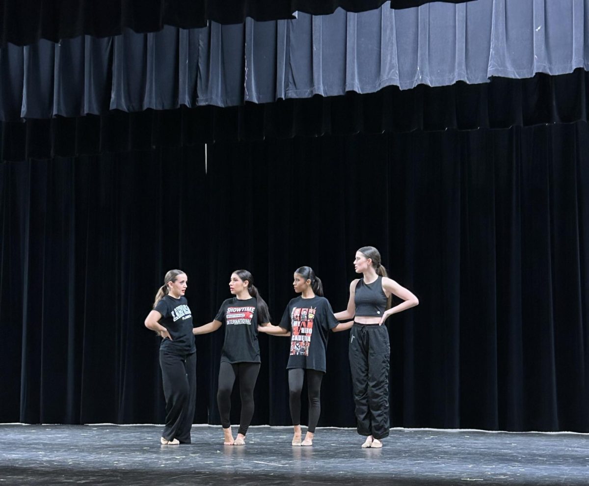 The Flames rehearse after school April 13 for their spring show.