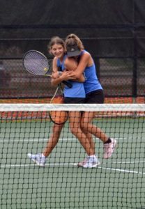 Freshman Madelynn White and Senior Caroline White celebrate their advance to state. Courtesy of Kenneth Peiser.