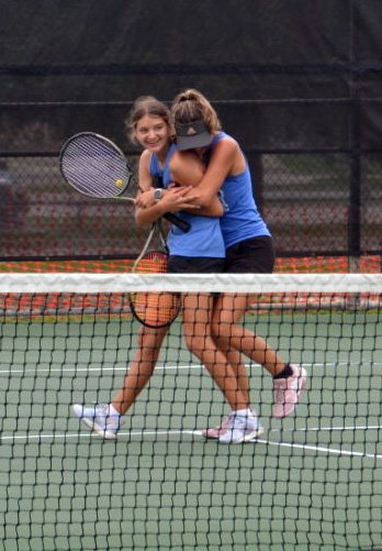 Freshman Madelynn White and Senior Caroline White celebrate their advance to state. Courtesy of Kenneth Peiser. 